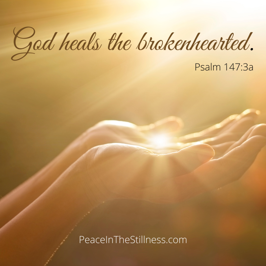 A pair of small hands cupped together holding a small bright light as if the rays of sun all converged into her palms. The Bible verse "God heals the brokenhearted." from Psalm 147:3a is at the top of the photo. 
by Beeda Speis from Peace In The Stillness Ministries