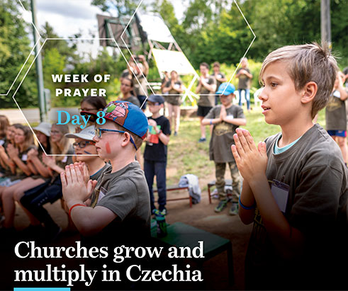 A group of young people standing and sitting with their hands together for prayer. Day 8 of the Week of Prayer for International Missions. The text says Churches grow and multiply in Czechia. Image by IMB