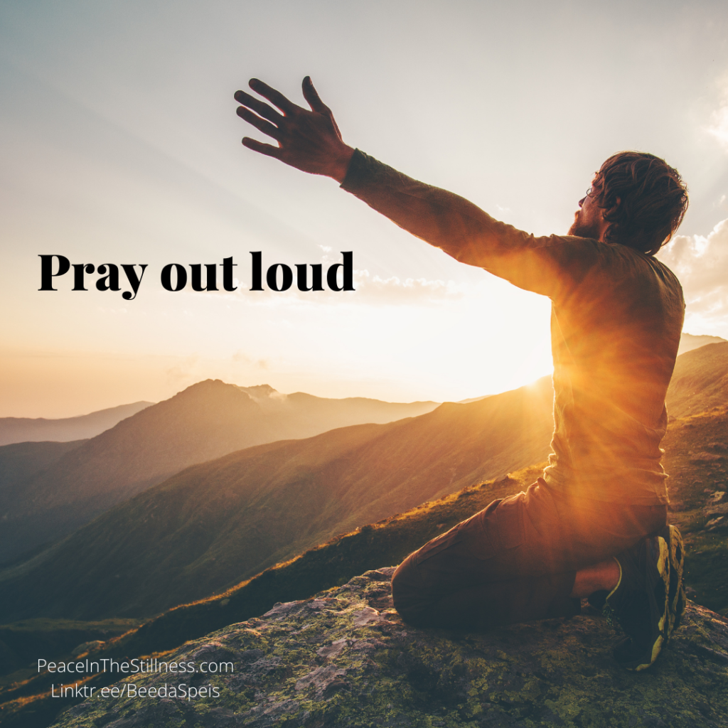A man on his knees on a rocky hill with his arms raised to the Heavens. The rising morning sun is in the background. The words "Pray out loud" are next to him.
by Beeda Speis for Peace In The Stillness blog