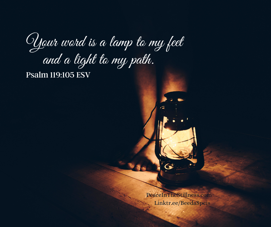 A lantern shining light on a person's feet with the words from Psalm 119:105 ESV: "Your word is a lamp to my feet and a light to my path." The Bible is God's living word.